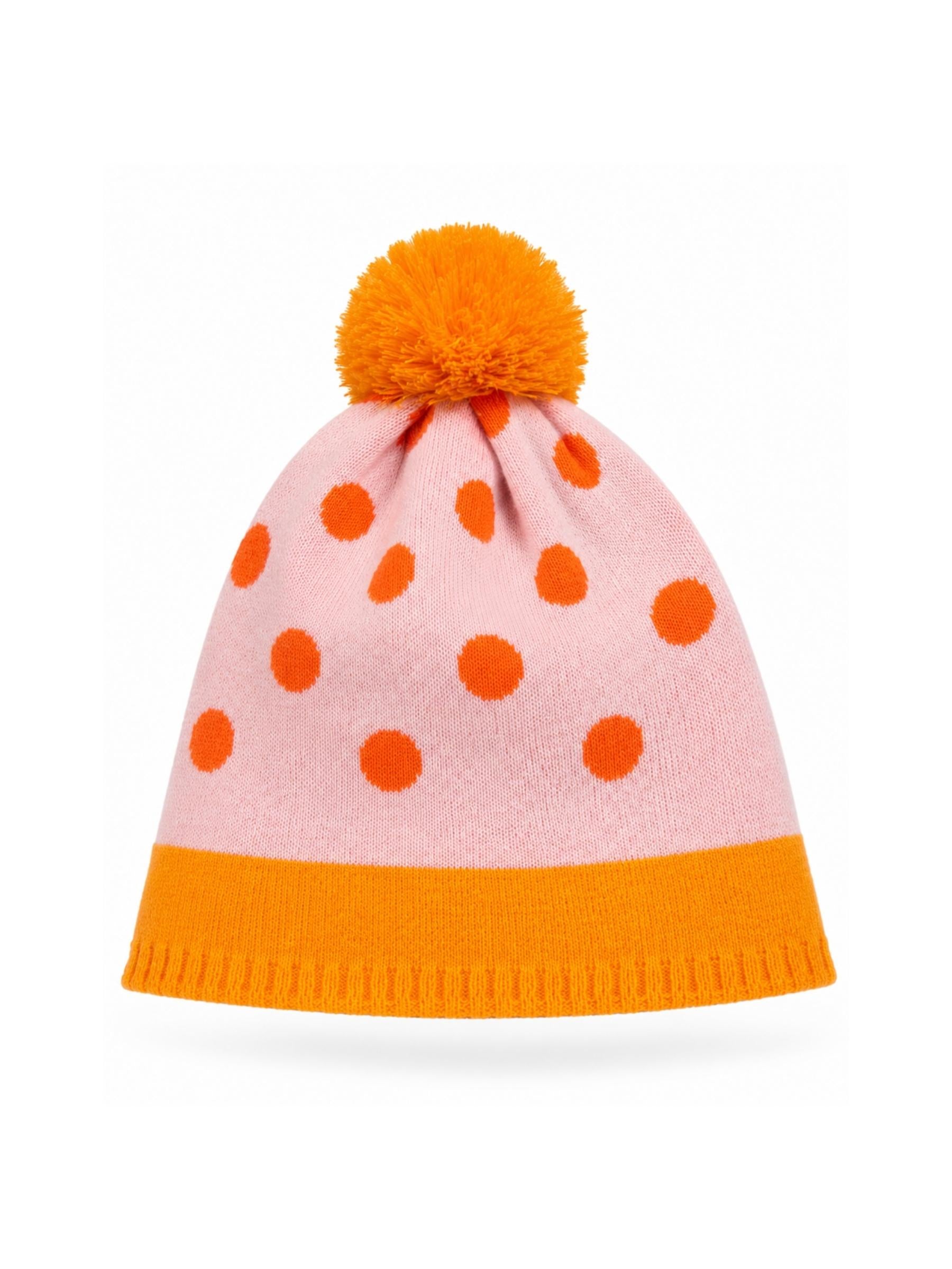 Pink beanie with orange polka dots and pom-pom on a white background