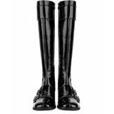Pair of black knee-high boots on a white background