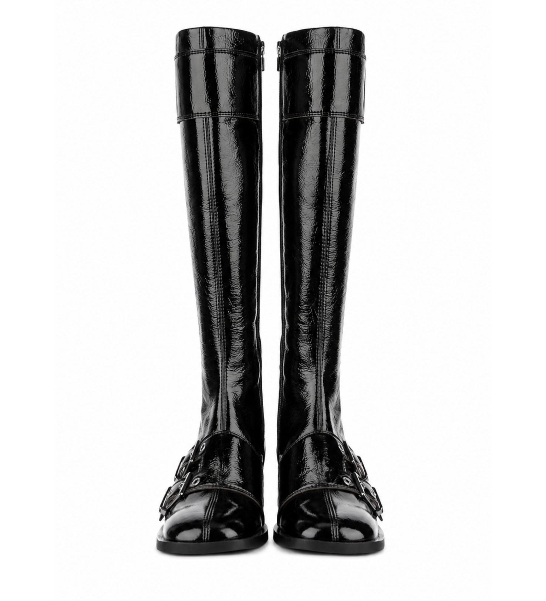 Pair of black knee-high boots on a white background