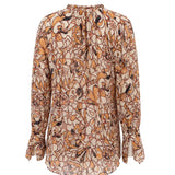 Floral patterned blouse on a white background